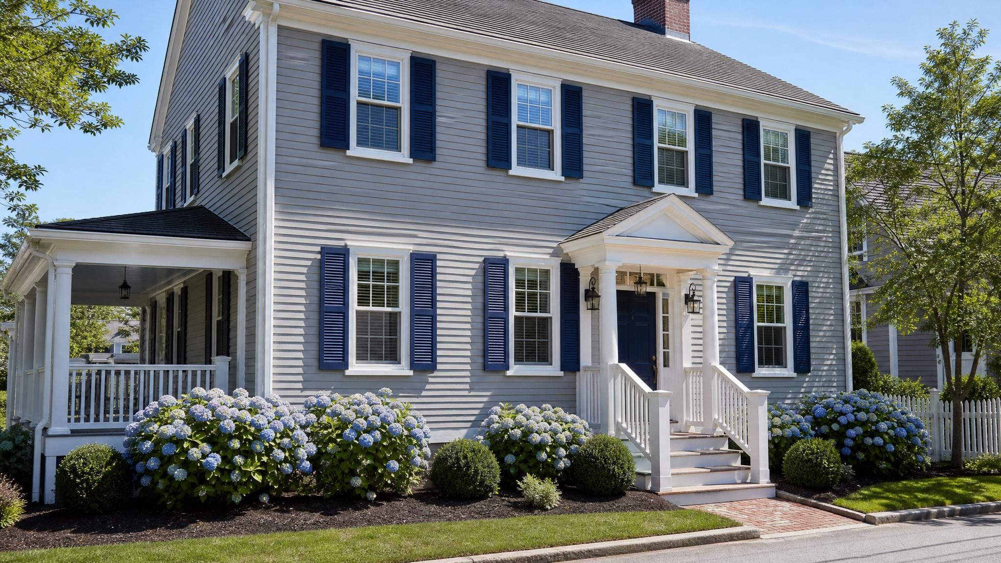 Finished exterior house painting with fresh siding and crisp trim.